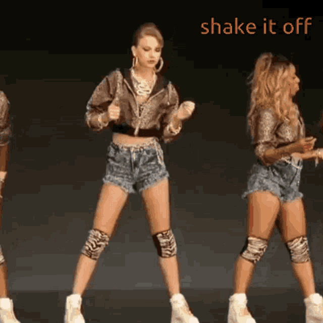a group of women are dancing with the words shake it off in the background