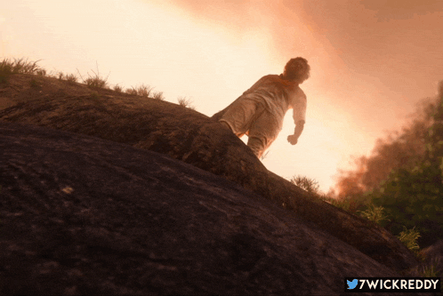 a picture of a person walking up a hill with the twitter username 7wickreddy at the bottom