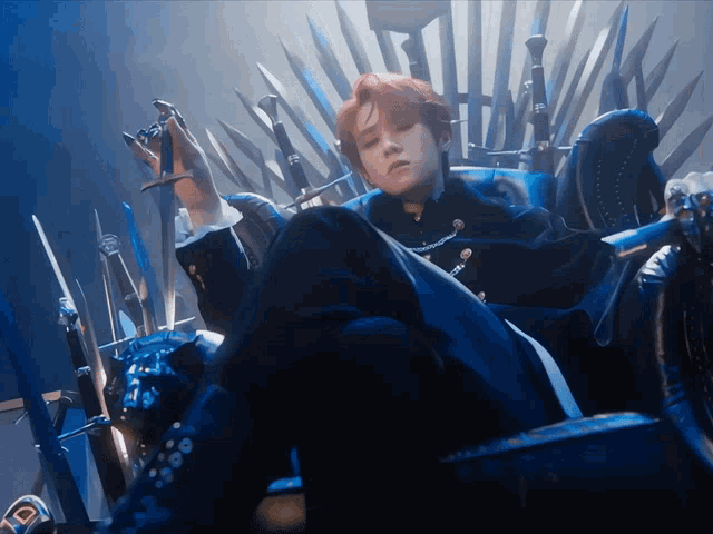 a man with red hair is sitting on a throne with swords