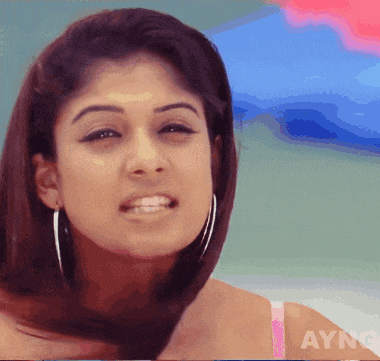 a close up of a woman 's face with aync written on the bottom