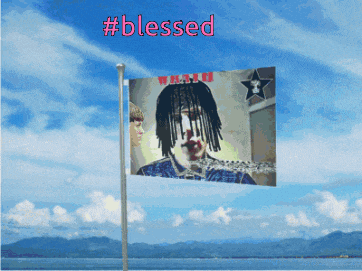 a flag with a picture of a man and the words blessed