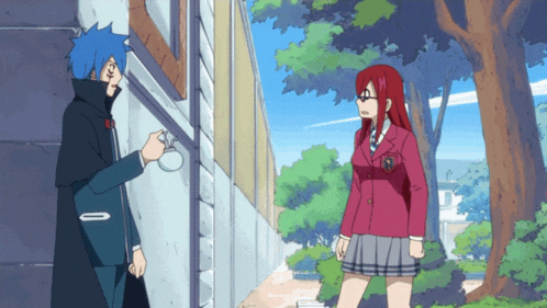 a girl in a red school uniform stands next to a man in a blue coat