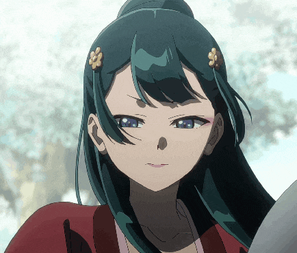 a close up of a girl with blue hair