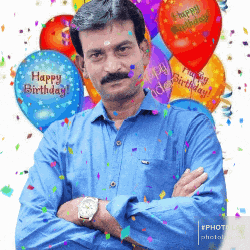a man in a blue shirt with balloons that say happy birthday