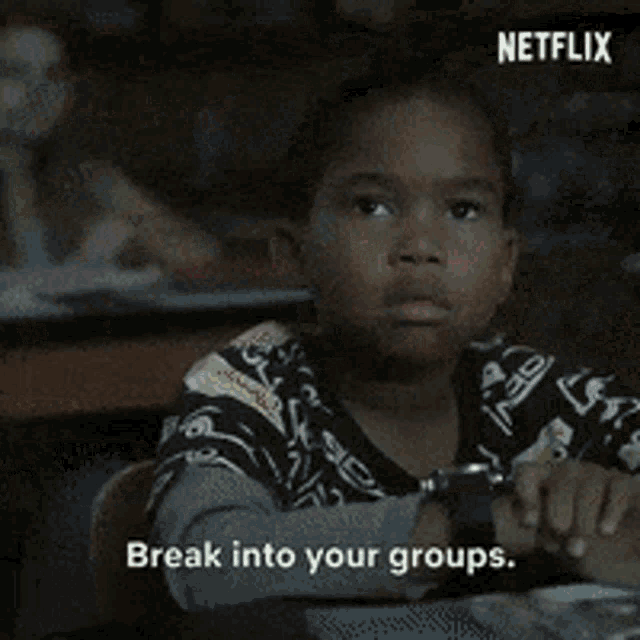 a group of people are sitting in front of a screen that says netflix