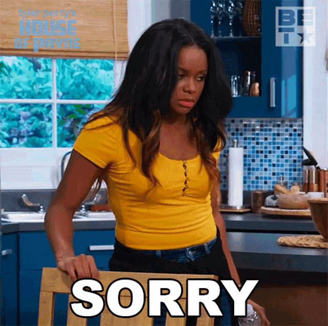 a woman in a yellow shirt says sorry