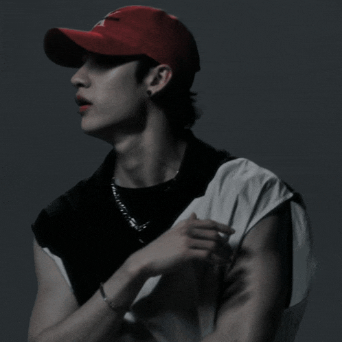 a man wearing a red hat with the letter a on the front