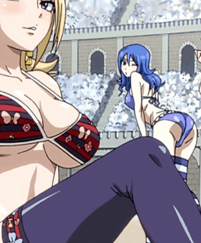 a woman in a bikini stands next to another woman in a bikini
