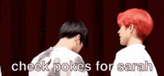 two men with red hair are standing next to each other and one of them is saying check pokes for sarah .