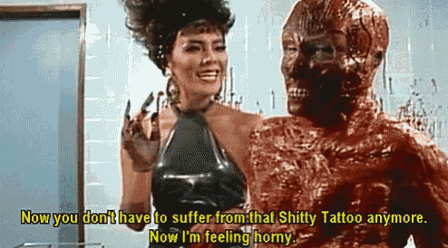 a woman is standing next to a man with a tattoo on his face and the words now you don 't have to suffer