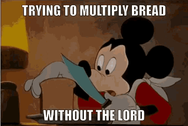 a cartoon of mickey mouse holding a knife in his mouth .