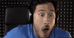 a man wearing headphones is making a funny face .