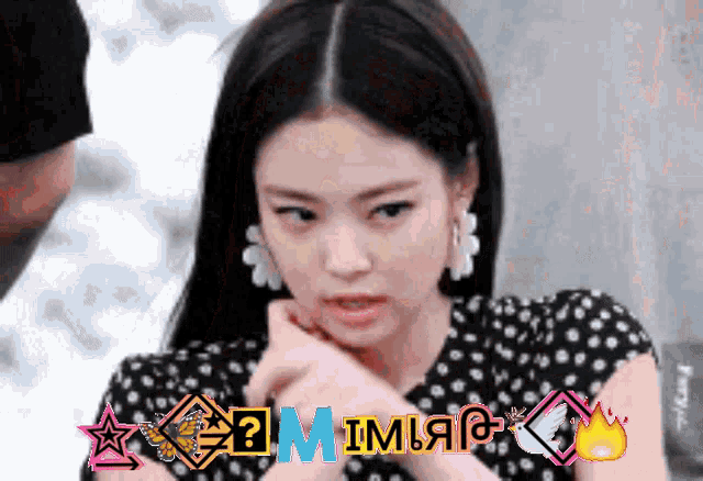 a woman wearing a black and white polka dot dress has the word mimic on the bottom of her face