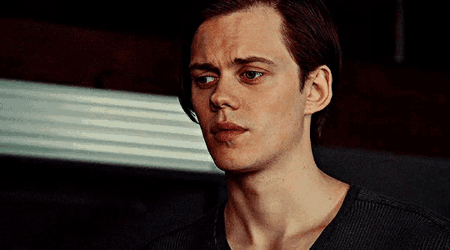 a close up of a man 's face with his eyes closed