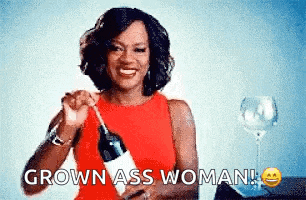 a woman in a red dress is holding a bottle of wine and saying grown ass woman !