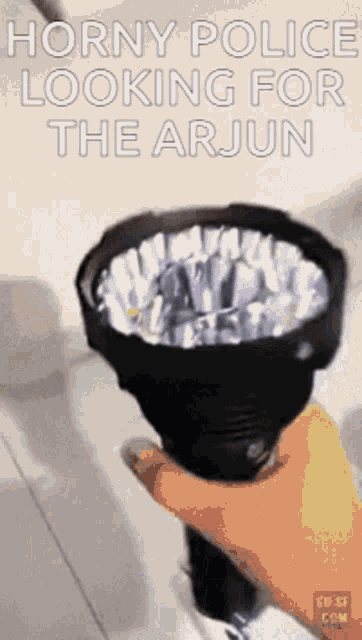 a person is holding a flashlight that says horny police looking for the arun