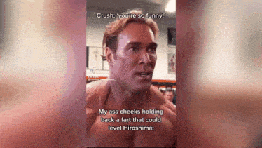 a muscular man is talking to another man in a gym .
