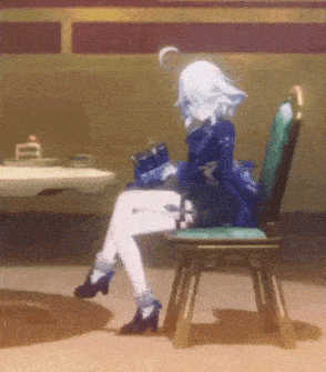 a girl in a blue dress is sitting on a chair in a room .
