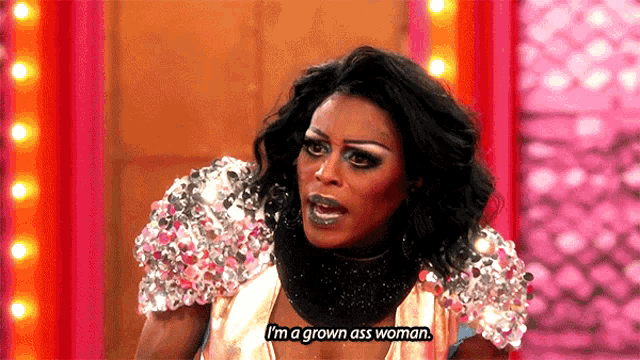a drag queen says " i 'm a grown ass woman " on stage