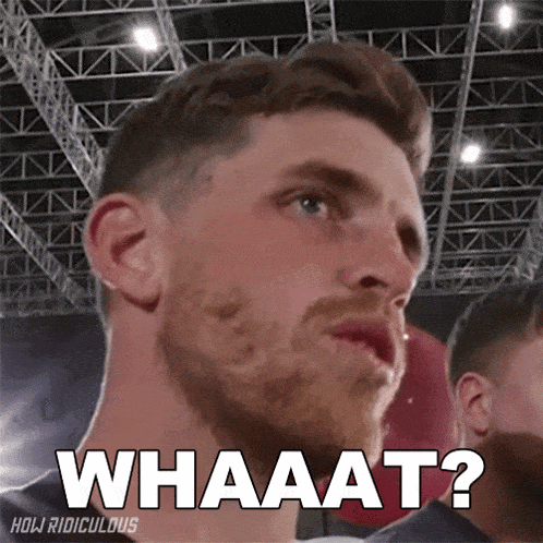 a close up of a man 's face with the words whaaat written above him