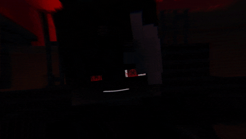a blurry picture of a dark room with a red light coming out of a window