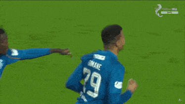 a group of soccer players wearing blue jerseys with the number 21 on them