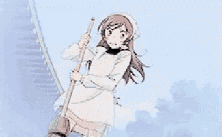 a girl in a white dress is holding a broom while standing on a staircase .
