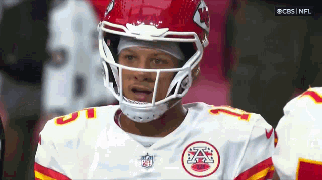 a football player wearing a helmet with a nfl logo on it