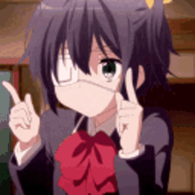 a girl wearing a mask and a red bow tie is pointing up