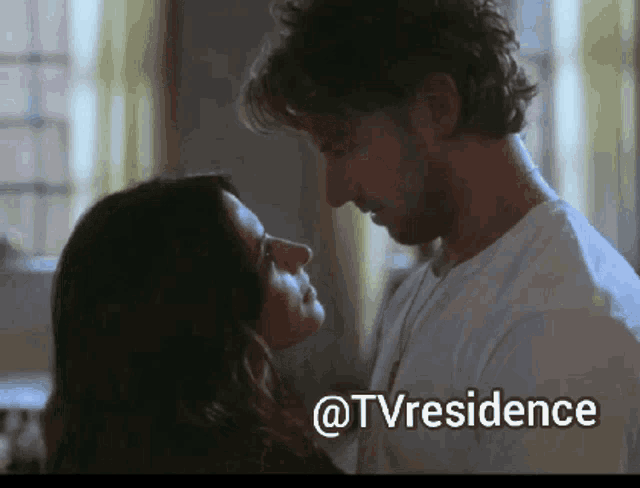 a picture of a man and woman kissing with the words @tvresidence above them