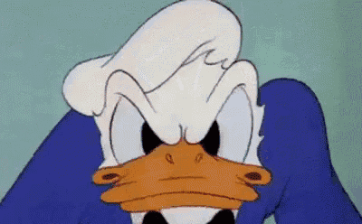 donald duck is wearing a blue suit and a black bow tie and making an angry face .
