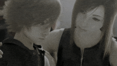 a black and white photo of a girl and a boy