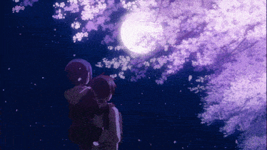 a couple standing under a tree with purple flowers looking at the moon