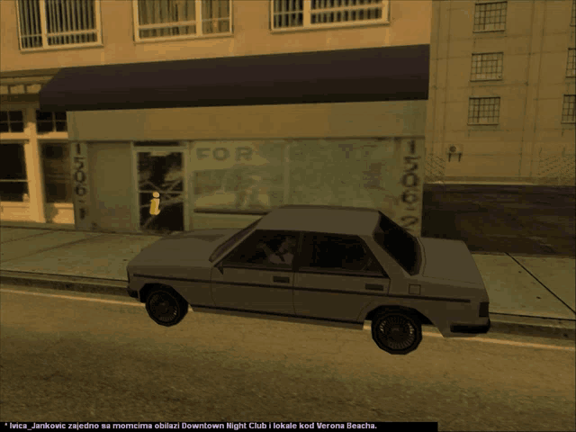 a car is parked in front of a building with a sign that says for rent