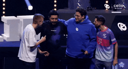 a group of men are standing next to each other on a stage in front of a sign that says celion