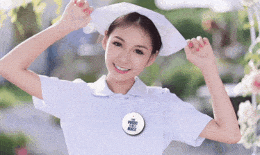 a nurse wearing a badge that says i 'm proud to be a nurse