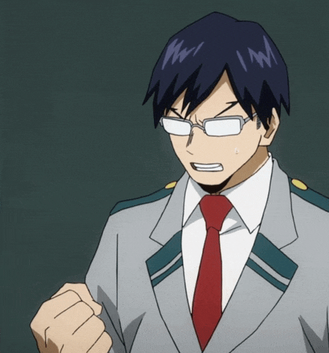 a man with glasses and a red tie is making a fist