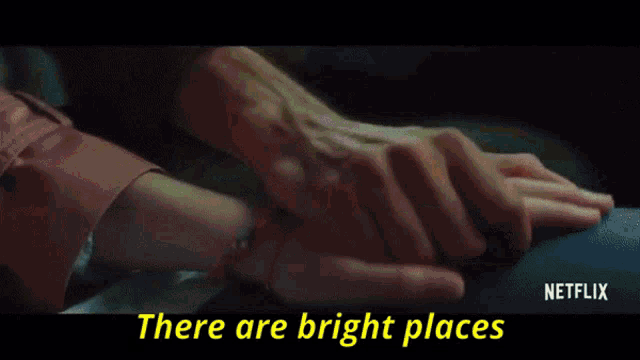 a man and a woman are sitting in a car with the words there are bright places above them