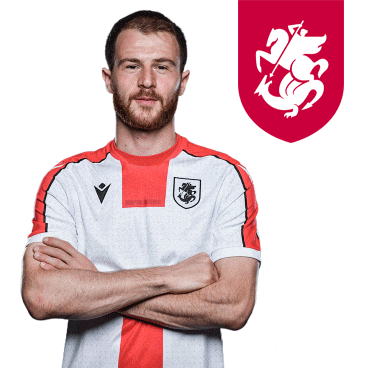 a man with his arms crossed wears a white and red shirt