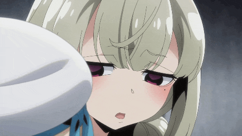 a close up of a girl 's face with a white hat