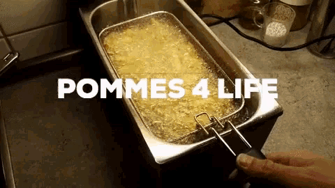 potatoes are being cooked in a fryer and the words pommes 4 life are above it