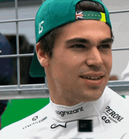 a man wearing a green hat and a white shirt with peroni written on it