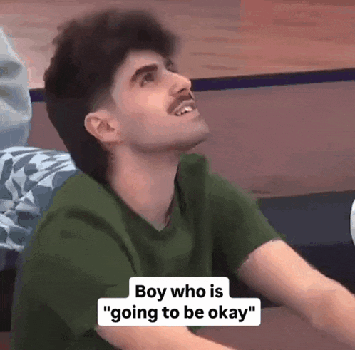 a man in a green shirt is smiling and says " boy who is going to be okay "