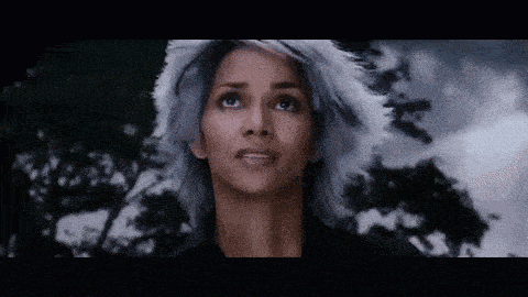 a close up of a woman with gray hair looking up
