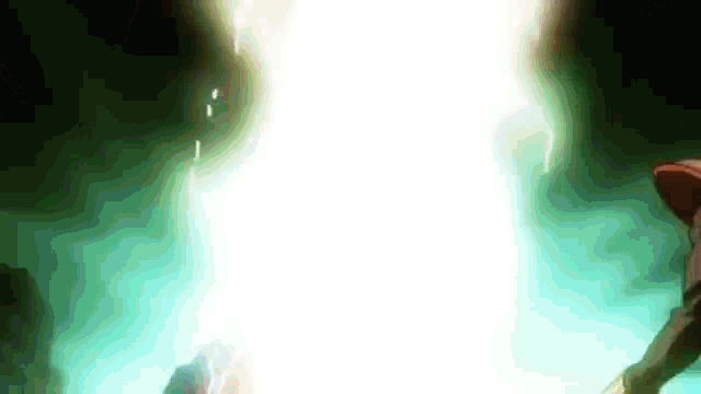 a person is standing in a dark room with a light coming out of the ceiling