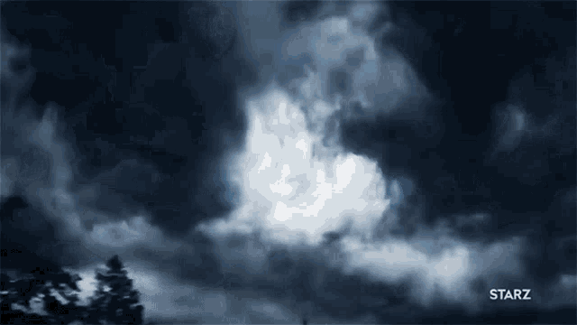 a dark cloudy sky with a starz logo in the lower right corner