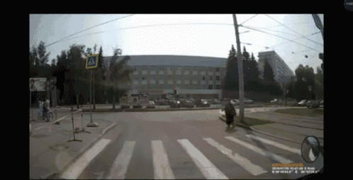 a screenshot of a crosswalk with a sign that says a on it