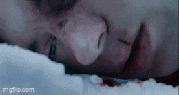 a close up of a person 's face with blood on it