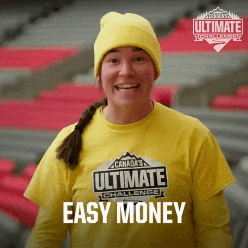a woman wearing a canada 's ultimate challenge shirt smiles