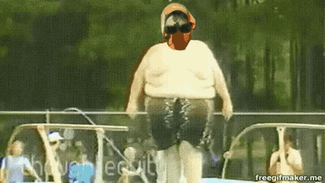 a fat man wearing headphones and sunglasses is jumping into a pool ..